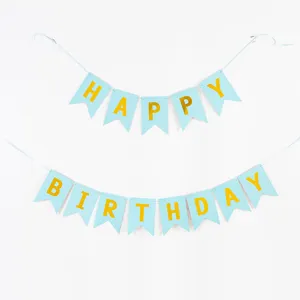 Blue swallowtail birthday banner with gold foil HAPPY BIRTHDAY lettering.