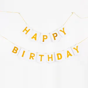 Close-up detail of premium gold foil Happy Birthday swallowtail bunting banner on white