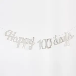 Silver happy 100 days letter banner detail shot for baby milestone party decoration.