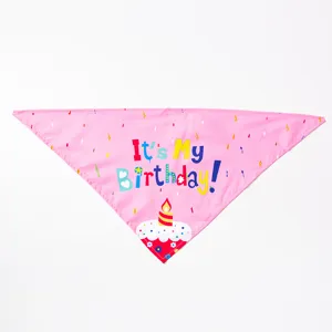 Details of the pink pet birthday bandana with cute cake print and festive text for dogs.