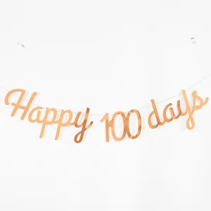 Detail view of the rose gold Happy 100 days banner, perfect for baby milestone celebrations.