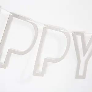 Close-up detail view of silver metallic hollow letter party banner garland decoration string.