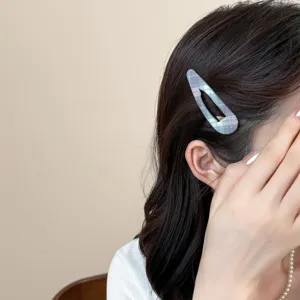 Blue plaid snap hair clip detail shot, elegant fabric hair accessory for women styling.