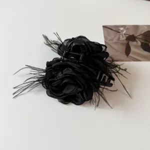Black organza camellia flower hair claw clip with feathers, elegant gothic hair accessory.