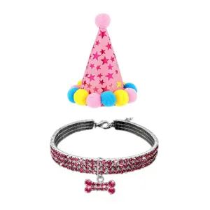 Close-up detail of shiny pink rhinestone pet collar and star pattern party hat set