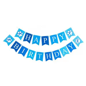 Close-up of blue Happy Birthday banner with paw prints for dog party decorations