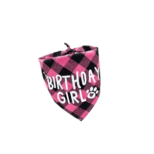 Detailed close-up of pink and black checkered pet bandana with Birthday Girl print