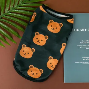 Detailed view of summer thin pet dog vest with cute bear print, breathable mesh fabric.