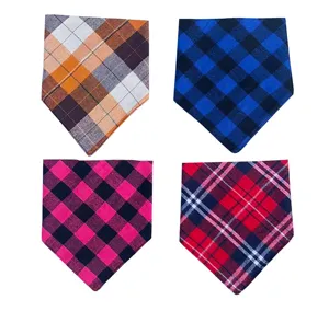 Close-up details of four colorful plaid pet bandanas, soft fabric and classic tartan patterns.