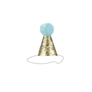 Detail view of a golden glitter pet party hat with a light blue fluffy pom-pom