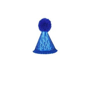 Close-up detail of a bright blue sequined pet party hat with a fluffy blue pom-pom top