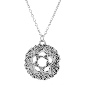 Detailed shot of vintage Viking Celtic knot pentagram amulet pendant necklace, silver tone.