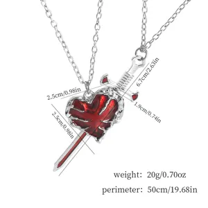 Gothic sword through heart necklace detail, metal chain with red enamel pendant, 50cm length.