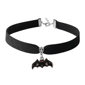 Black velvet choker necklace detail featuring a spooky bat pendant with ghost and cross accents.