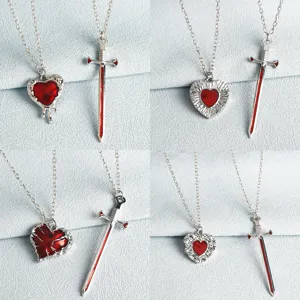 Couple heart sword necklace set, gothic punk style silver chain red pendant jewelry details.