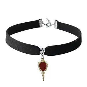 Gothic black velvet choker necklace with vintage retro mirror pendant, dark style jewelry accessory.