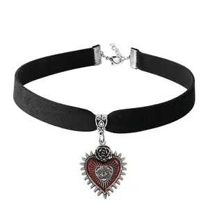 Black velvet choker necklace detail, gothic vintage red heart pendant, alternative jewelry.