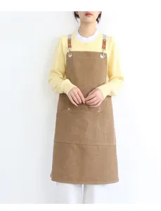 Brown heavy duty canvas work apron with leather straps for kitchen and coffee shop