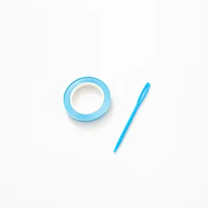 Blue craft tape and plastic needle detail view, ideal for DIY handmade projects and decorations.
