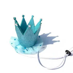 Close-up detail of blue glitter pet birthday crown hat with tulle and adjustable elastic band.