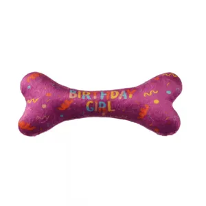 Purple plush dog chew toy in bone shape with birthday girl print for pets detail view.