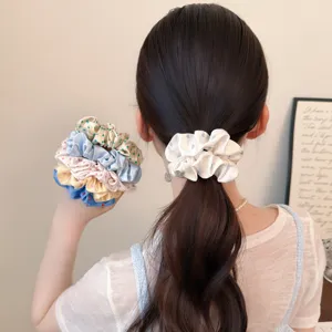 Korean style sweet heart polka dot scrunchie detail view, soft hair tie for ponytail.