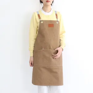 Thickened canvas work apron for women, stylish brown kitchen apron with leather straps and pockets.