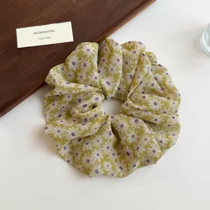 Floral scrunchie for women, cute daisy print hair tie, aesthetic hair accessory detail.