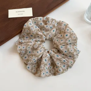 Floral print hair scrunchie for women, cute daisy design elastic hair tie ponytail holder accessory.