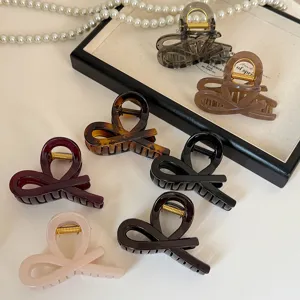 Molla per capelli acrilico design cavo crociato elegante pinza donna accessori acconciatura