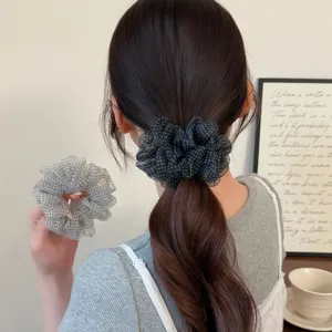 Detail view of Korean style dot organza hair scrunchie, fluffy mesh ponytail holder for women.