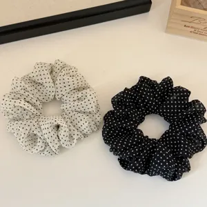 Close-up detail of Korean style polka dot organza hair scrunchies, soft mesh hair ties.
