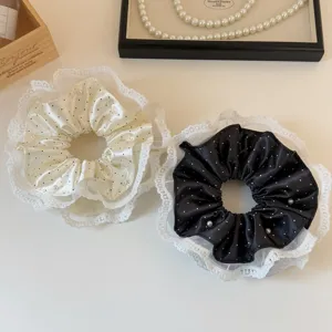 Elegant polka dot satin scrunchies with white lace trim and pearls for stylish women hair styling.