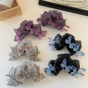 Mesh Schmetterling Haarklammern mit funkelnden Strassdetails für elegante Frisuren und Looks.