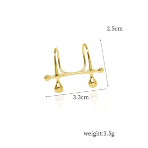 Close-up detail of golden punk style non-piercing lip cuff showing dimensions and weight.