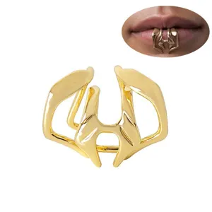 Gold punk non-piercing lip cuff clip jewelry, edgy minimalist metal lip ring accessory.