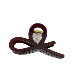 Elegante molletta per capelli in acrilico con design cavo incrociato per le donne.