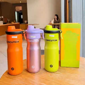 Detailed view of colorful stainless steel sports water bottles with straw and matching gift box.