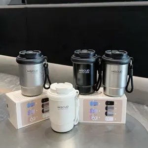 Portable stainless steel vacuum insulated coffee cup tumbler with lid and strap, solid color.