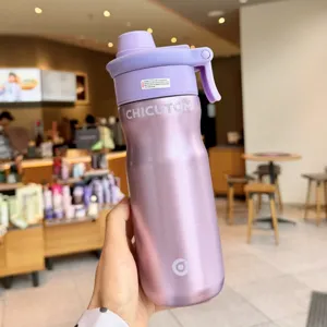 Detailed view of the purple stainless steel insulated water bottle with portable handle.