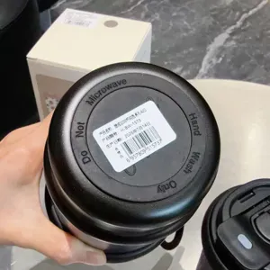 Portable stainless steel coffee mug vacuum insulated travel water bottle with dual-drink lid.