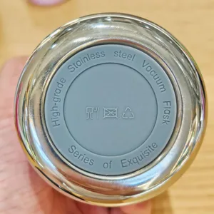 Stainless steel vacuum flask bottom detail, high grade food safe material cup base.