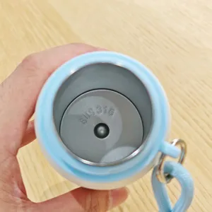 Stainless steel vacuum insulated water bottle interior detail view with strap 316 lining