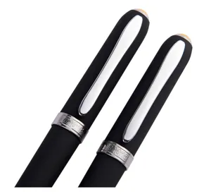 Close-up detail of black rollerball pen with silver metal clip and engraved brand ring.