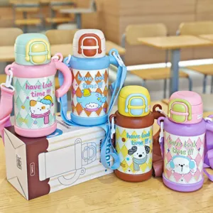 Cute cartoon stainless steel kids water bottle featuring straw, strap and cute handles.