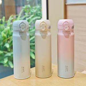 Gradient stainless steel vacuum insulated water bottle with pop-up lid, portable cup.