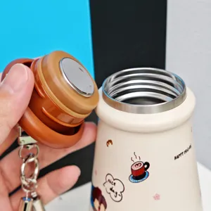 Stainless steel vacuum insulated water bottle with cute cartoon prints and portable strap.