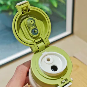 Stainless steel insulated water bottle lid detail showing double drink silicone design.