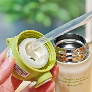 Detail view of a stainless steel vacuum insulated water bottle with dual-drink lid and straw.