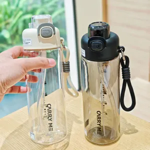 Portable double-drink sports water bottle with straw and capacity scale, clear fitness cup.